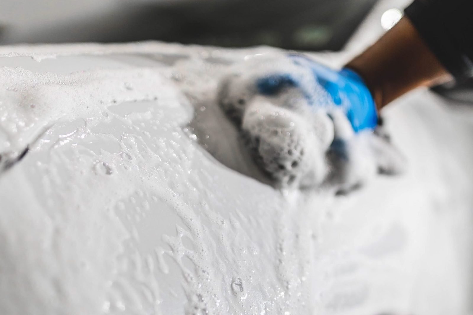 Thick foam covering paint during the decontamination stage of auto detailing