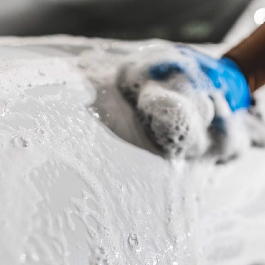 Thick foam covering paint during the decontamination stage of auto detailing