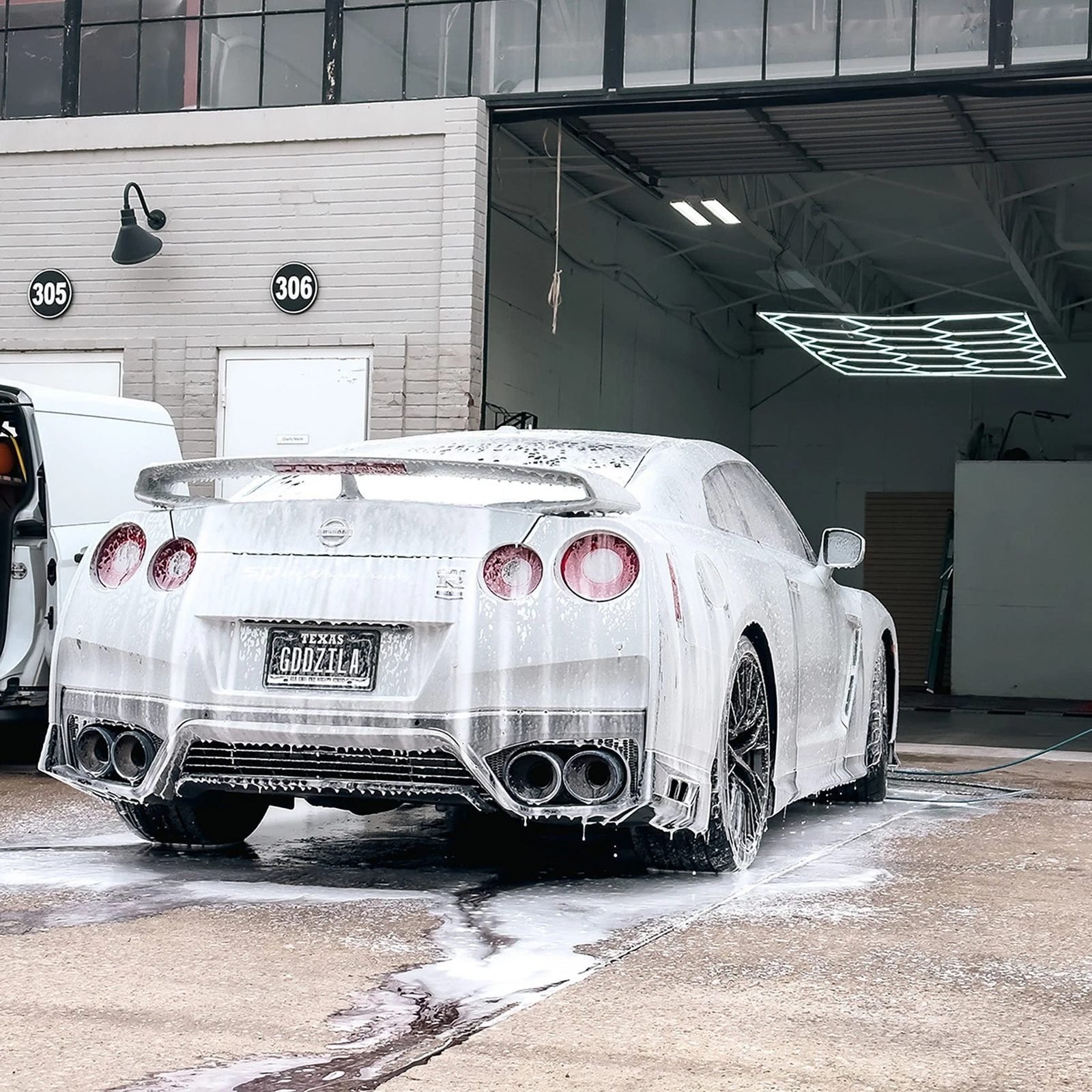 Sports car covered in foam during a safe hand wash