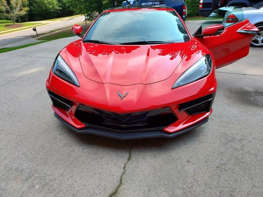 Red Corvette with a ceramic coated finish showing deep reflection