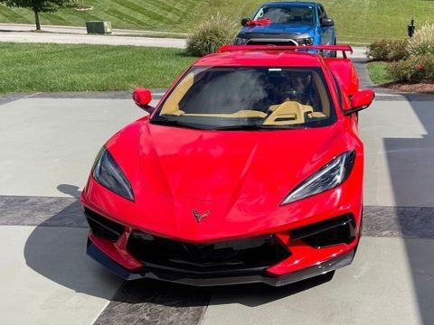 Red Corvette with corrected paint reflecting cleanly after machine polishing