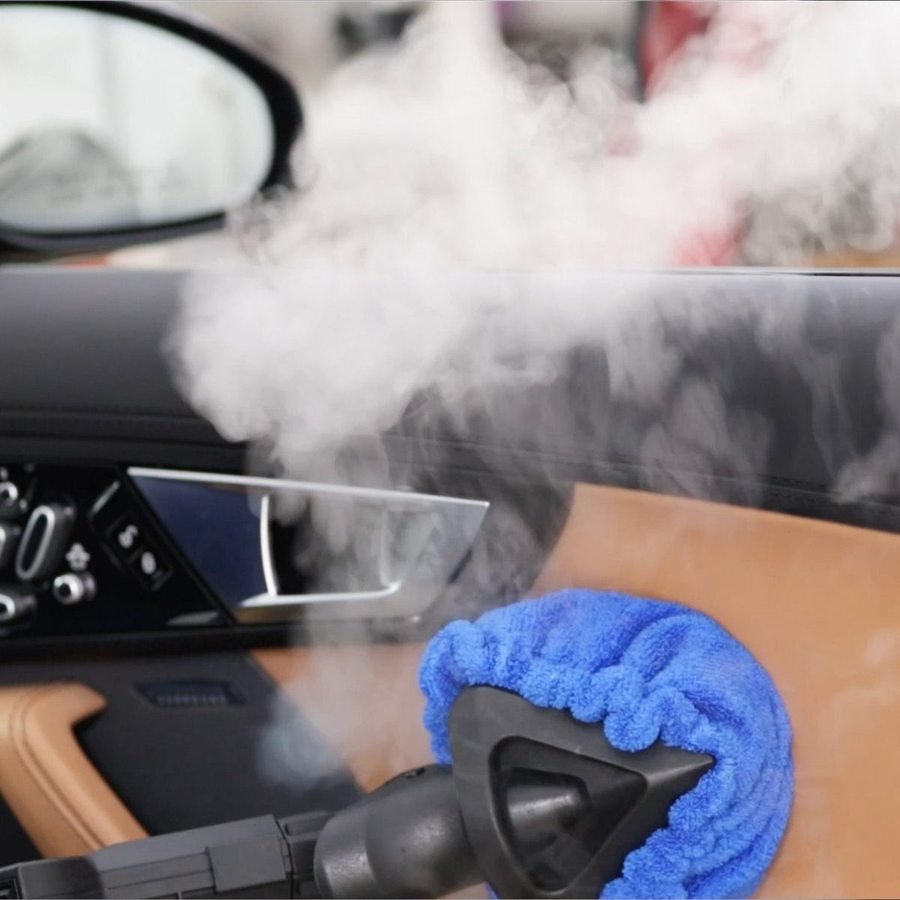 Steam cleaning a vehicle door panel and jamb