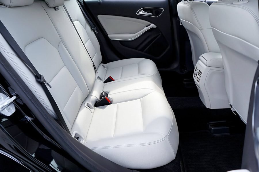 Clean white leather vehicle interior after professional interior car detailing
